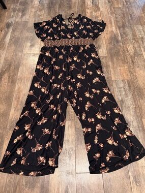 Anthropologie Black Jumpsuit with Peach Floral Print and Smocked Waist
